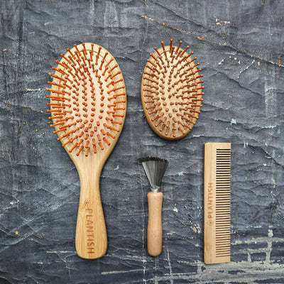 This sustainable bamboo hair brush set includes a travel brush and paddle brush for detangling, smoothing, and styling hair anywhere. The natural bristle brushes stimulate the scalp while removing tangles.