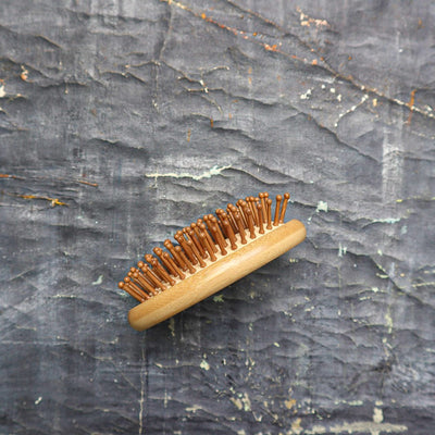 When traveling light, these portable brushes in compact sizes are all that's needed to maintain beautiful hair. The bristle brush massages the scalp while detangling knots from roots to ends.