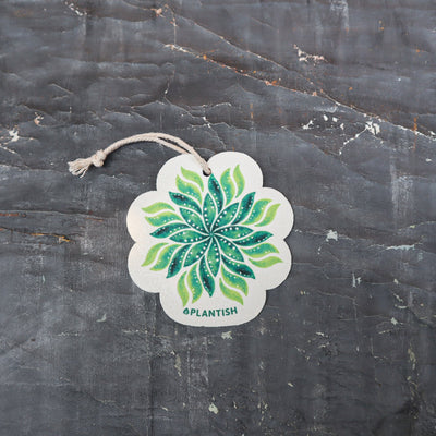 Meet your new kitchen essential - an eco-conscious pop-up sponge that transforms from slim to plump! This top-view reveals its beautiful leaf-print design on biodegradable cellulose. Complete with hanging cord, it smartly switches between space-saving dry mode (flat) and super-absorbent wet mode (expanded), making sustainable cleaning stylish and practical.