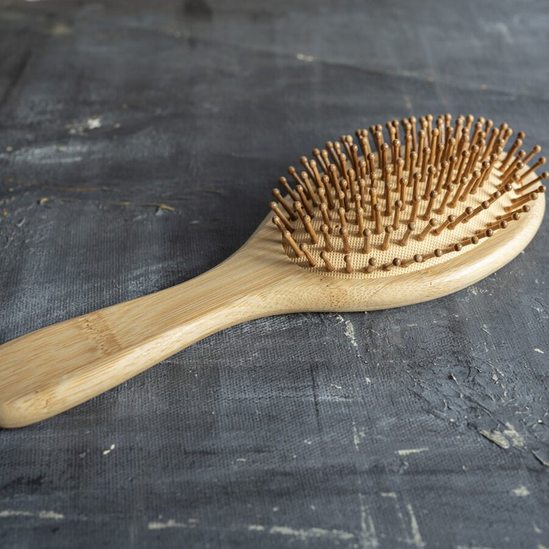 this bamboo hairbrush is adept at addressing static-induced flyaways, tangles, and frizz. Its rounded bristles not only refine hair texture but also offer a relaxing scalp massage, encouraging blood circulation and potentially minimizing hair loss.