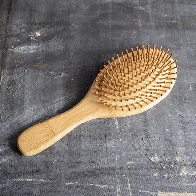this bamboo hairbrush efficiently combats static-induced flyaways, tangles, and frizz. Its rounded bristles not only enhance hair texture but also provide a gentle scalp massage, encouraging blood circulation and potentially averting hair loss.