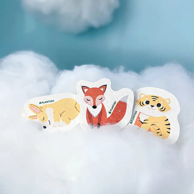 Three animal pop up sponges on a cloud for eco friendly kitchen cleaning. Made of wood pulp making it plastic free and compostable.