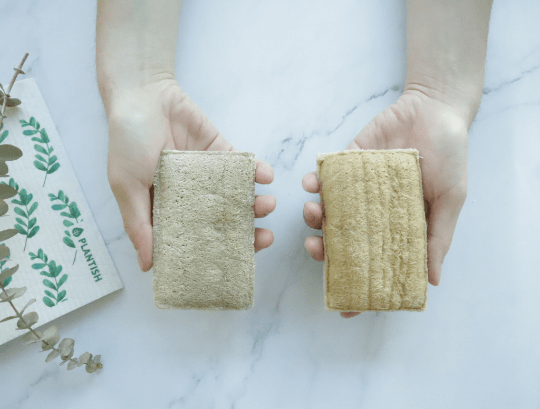 Bottom side of plastic-free, beige loofah eco sponge for cleaning.